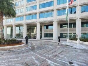 A clean driveway after hot water pressure washing Jacksonville FL, showcasing effective cleaning results.